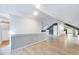Bonus room featuring gray vinyl floors, skylight and a doorway to a kitchen at 1715 Us 15-501 S, Chapel Hill, NC 27517