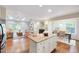 Open concept kitchen with island, breakfast nook and view of living room fireplace at 1715 Us 15-501 S, Chapel Hill, NC 27517