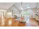 Bright living room features vaulted ceilings, skylights, hardwood floors, and built in shelving at 1715 Us 15-501 S, Chapel Hill, NC 27517
