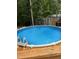 The fenced-in above ground pool with decking is easily accessible by a ladder and offers a private retreat at 1715 Us 15-501 S, Chapel Hill, NC 27517