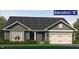 Charming home with gray siding, white trim, a two-car garage and a well manicured front yard at 1737 Pecan Drive # 21, Nashville, NC 27856