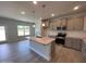 Kitchen showcasing a center island, granite countertops, stainless steel appliances, and gray cabinets at 1737 Pecan Drive # 21, Nashville, NC 27856