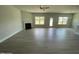 Spacious living room with modern floors, a fireplace, large windows, and backyard access at 1737 Pecan Drive # 21, Nashville, NC 27856