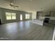 Bright, open-concept living room connected to a kitchen island, featuring windows, and modern flooring at 1737 Pecan Drive # 21, Nashville, NC 27856