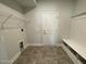 Welcoming mudroom featuring stylish tile floors, a functional bench with storage, and convenient access to the home's exterior at 1737 Pecan Drive # 21, Nashville, NC 27856