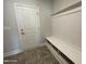 Stylish mudroom with a white bench and built-in storage, offering a practical and organized space for entry at 1737 Pecan Drive # 21, Nashville, NC 27856