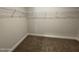 Walk-in closet with carpeting and wire shelving, offering plenty of storage for clothes and accessories at 1737 Pecan Drive # 21, Nashville, NC 27856