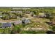 Luxury homes in golf course community with rolling greens, sand traps, and mature trees at 2066 Lake Point Dr, Graham, NC 27253