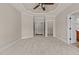 Carpeted bedroom with multiple doorways, a tray ceiling, and recessed lighting at 2066 Lake Point Dr, Graham, NC 27253