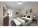 Neutral bedroom offers great natural light, large windows, and modern furnishings at 2066 Lake Point Dr, Graham, NC 27253