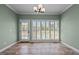 Breakfast nook with tile flooring and plantation shutters leading to outside deck at 2066 Lake Point Dr, Graham, NC 27253
