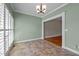 View of breakfast nook with tile floor, light fixture, and plantation shutters at 2066 Lake Point Dr, Graham, NC 27253
