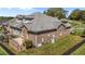 The exterior of the home features a brick exterior, gray roof, and lush lawn at 2066 Lake Point Dr, Graham, NC 27253