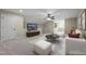 Living room featuring white sofas, modern furniture, and neutral decor at 2066 Lake Point Dr, Graham, NC 27253