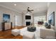 Cozy living room with a fireplace, plush seating, and modern decor at 2066 Lake Point Dr, Graham, NC 27253