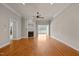 Bright living room features a fireplace, hardwood floors, and recessed lighting at 2066 Lake Point Dr, Graham, NC 27253