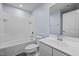Bright bathroom with a combination bathtub/shower, a vanity, and light-blue painted walls at 209 Timber Forest Ln, Cary, NC 27519