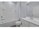 A modern bathroom with tub and shower and a single sink vanity at 209 Timber Forest Ln, Cary, NC 27519