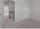Neutral painted bedroom features neutral carpet and a view of the backyard at 209 Timber Forest Ln, Cary, NC 27519