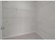 A spacious walk-in closet with multiple wire shelves for organized storage at 209 Timber Forest Ln, Cary, NC 27519