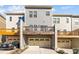 Exterior view of townhomes featuring garage and balcony, with neutral color palettes at 209 Timber Forest Ln, Cary, NC 27519