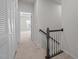 Hallway features carpeted floors, neutral walls, and access to bedrooms at 209 Timber Forest Ln, Cary, NC 27519