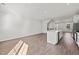 Open-concept living room features recessed lighting and wood-look flooring at 209 Timber Forest Ln, Cary, NC 27519