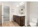 En suite bathroom featuring a double vanity, tile flooring, and ample storage at 2103 Glenkirk Dr, Burlington, NC 27215