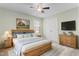 Comfortable bedroom with natural wood furniture and calming green walls at 2103 Glenkirk Dr, Burlington, NC 27215
