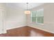 Well-lit dining room with hardwood floors and natural lighting at 2103 Glenkirk Dr, Burlington, NC 27215