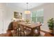 Elegant dining room with hardwood floors and a large window at 2103 Glenkirk Dr, Burlington, NC 27215