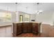 Kitchen island with granite top and stylish pendant lighting at 2103 Glenkirk Dr, Burlington, NC 27215