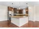 Well-equipped kitchen with an island, granite counters, and stainless appliances at 2103 Glenkirk Dr, Burlington, NC 27215