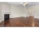 Bright living room with hardwood floors and a classic fireplace at 2103 Glenkirk Dr, Burlington, NC 27215