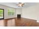 Spacious living room featuring hardwood floors and a cozy fireplace at 2103 Glenkirk Dr, Burlington, NC 27215