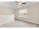 Spacious loft area with neutral carpet, ceiling fan, and ample natural light at 2103 Glenkirk Dr, Burlington, NC 27215
