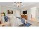 Relaxing main bedroom with en suite bathroom, ceiling fan, and natural lighting at 2103 Glenkirk Dr, Burlington, NC 27215