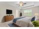 Comfortable main bedroom with ceiling fan, dresser, and natural lighting at 2103 Glenkirk Dr, Burlington, NC 27215