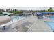 Community pool area featuring a splash pad and a waterslide for Gathering fun at 2103 Glenkirk Dr, Burlington, NC 27215