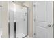 Modern bathroom featuring a tile shower with glass door and silver hardware at 2103 Glenkirk Dr, Burlington, NC 27215