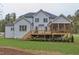 Back of the home with a spacious yard and deck, showcasing the architectural style and outdoor living spaces at , Chapel Hill, NC 27514