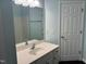 Light and airy bathroom with large mirror and white vanity at 2124 Claret Ln, Morrisville, NC 27560