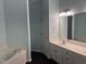 Large primary bathroom featuring a soaking tub, double sink vanity, and a separate shower at 2124 Claret Ln, Morrisville, NC 27560