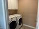 Convenient laundry room with modern washer and dryer units at 2124 Claret Ln, Morrisville, NC 27560