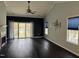 Spacious living room features hardwood floors, fireplace, natural light, and a ceiling fan at 2124 Claret Ln, Morrisville, NC 27560