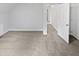 A sunlit bedroom reveals fresh paint, neutral carpet, and a smooth transition to the rest of the home at 213 Dwelling Pl, Knightdale, NC 27545