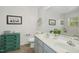 Stylish bathroom with double sinks, a large mirror, and decorative accents at 213 Meadow Fox Rd, Holly Springs, NC 27540