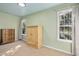 Bedroom features two windows and neutral carpet, offering ample natural light at 213 Meadow Fox Rd, Holly Springs, NC 27540