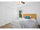 Inviting bedroom featuring a wood headboard, cozy bedding, and ample natural light, creating a relaxing atmosphere at 213 Meadow Fox Rd, Holly Springs, NC 27540