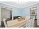 Charming dining room with stylish furnishings, bright light, and doorways to the living room and kitchen at 213 Meadow Fox Rd, Holly Springs, NC 27540
